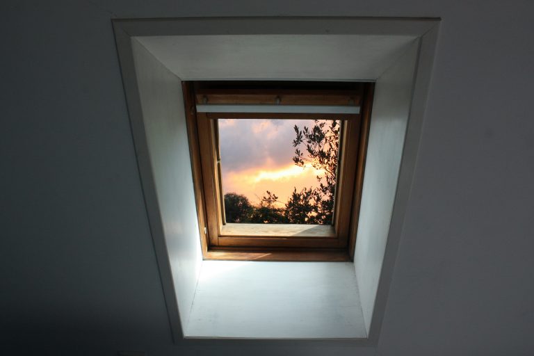 Roof window view of the interior on the outside Setting sun